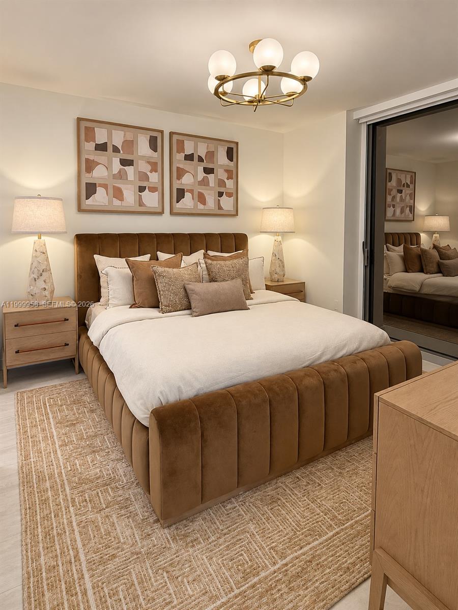Staged bedroom with a brown channel-tufted bed, neutral pillows, and matching abstract prints.