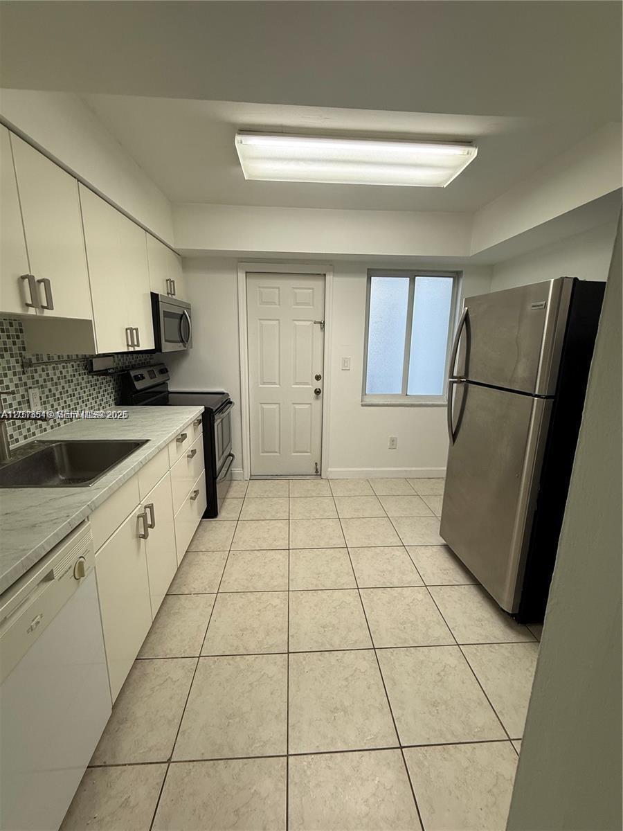 9971 W Bay Harbor Dr # 205