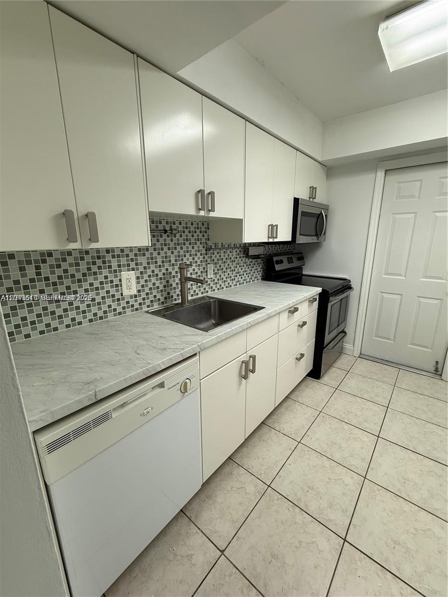 9971 W Bay Harbor Dr # 205