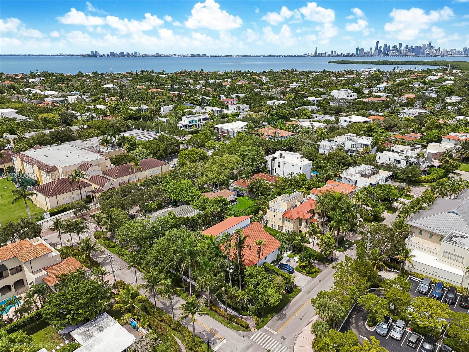 Aerial view of Key Biscayne homes, Biscayne Bay, and the Miami skyline.