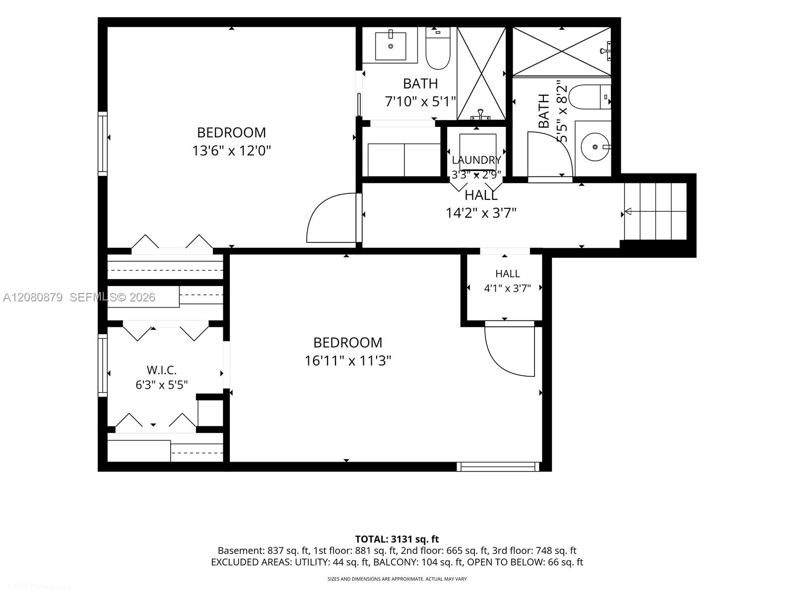 Floor plan with two bedrooms, two bathrooms, laundry, and a walk-in closet labeled with dimensions.