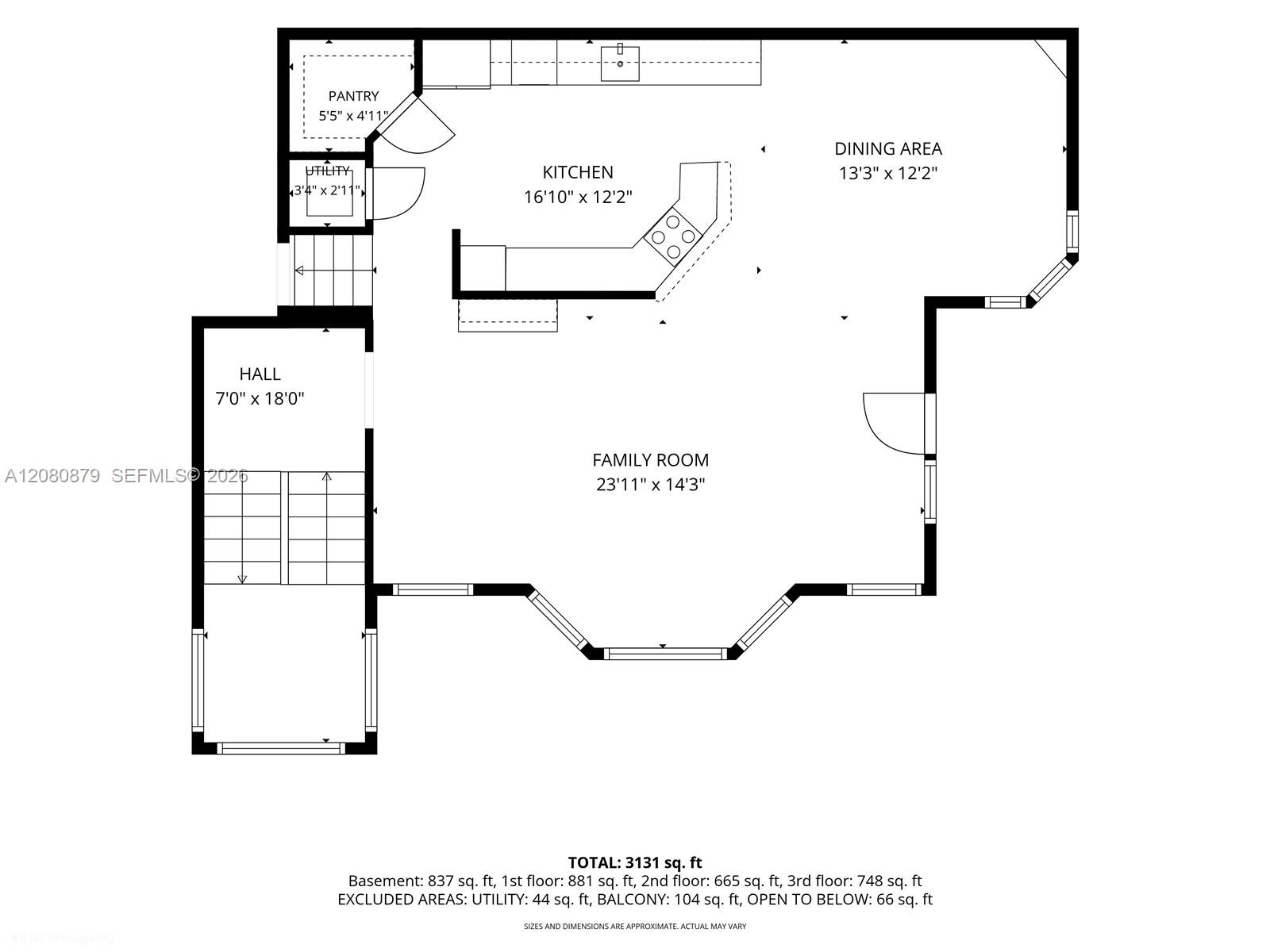 Floor plan showing a kitchen, dining area, family room, hall, pantry, and utility room.