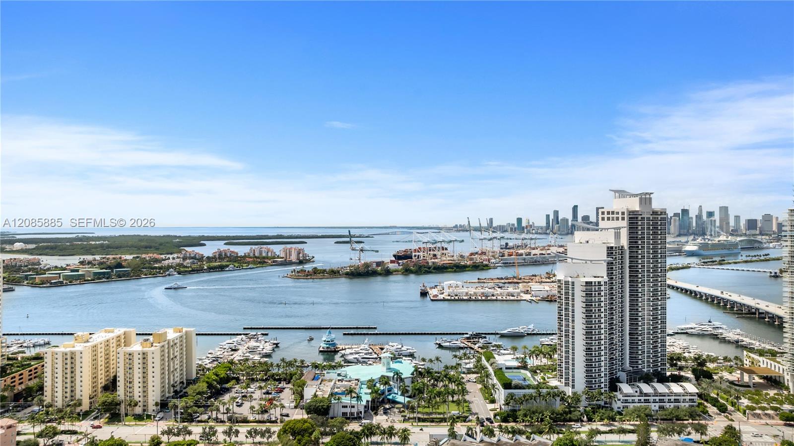 Biscayne Bay and Miami skyline, with marinas and waterfront high-rises in the foreground.