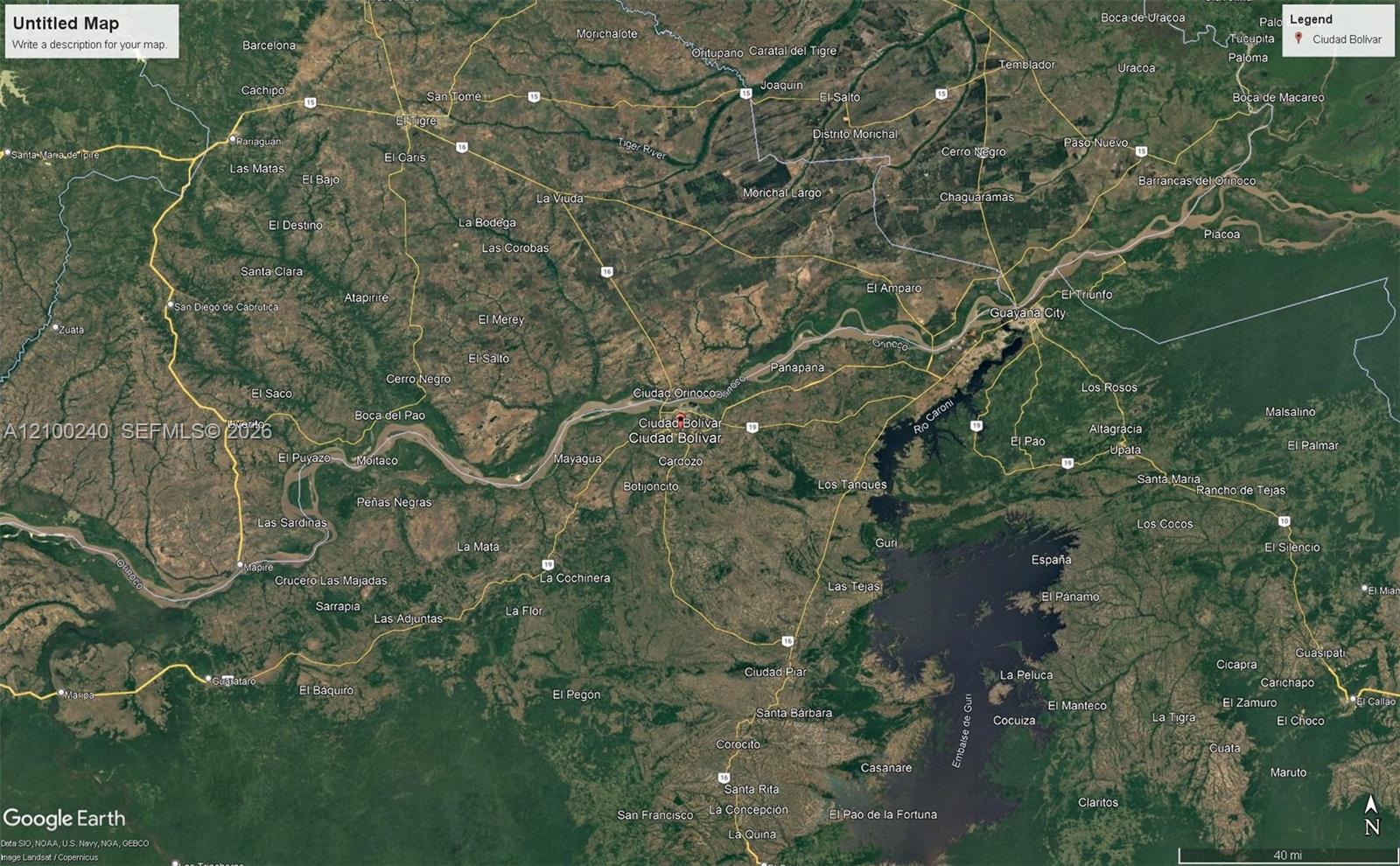Satellite map of Ciudad Bolívar and the Orinoco River in Venezuela, with nearby towns and roads.