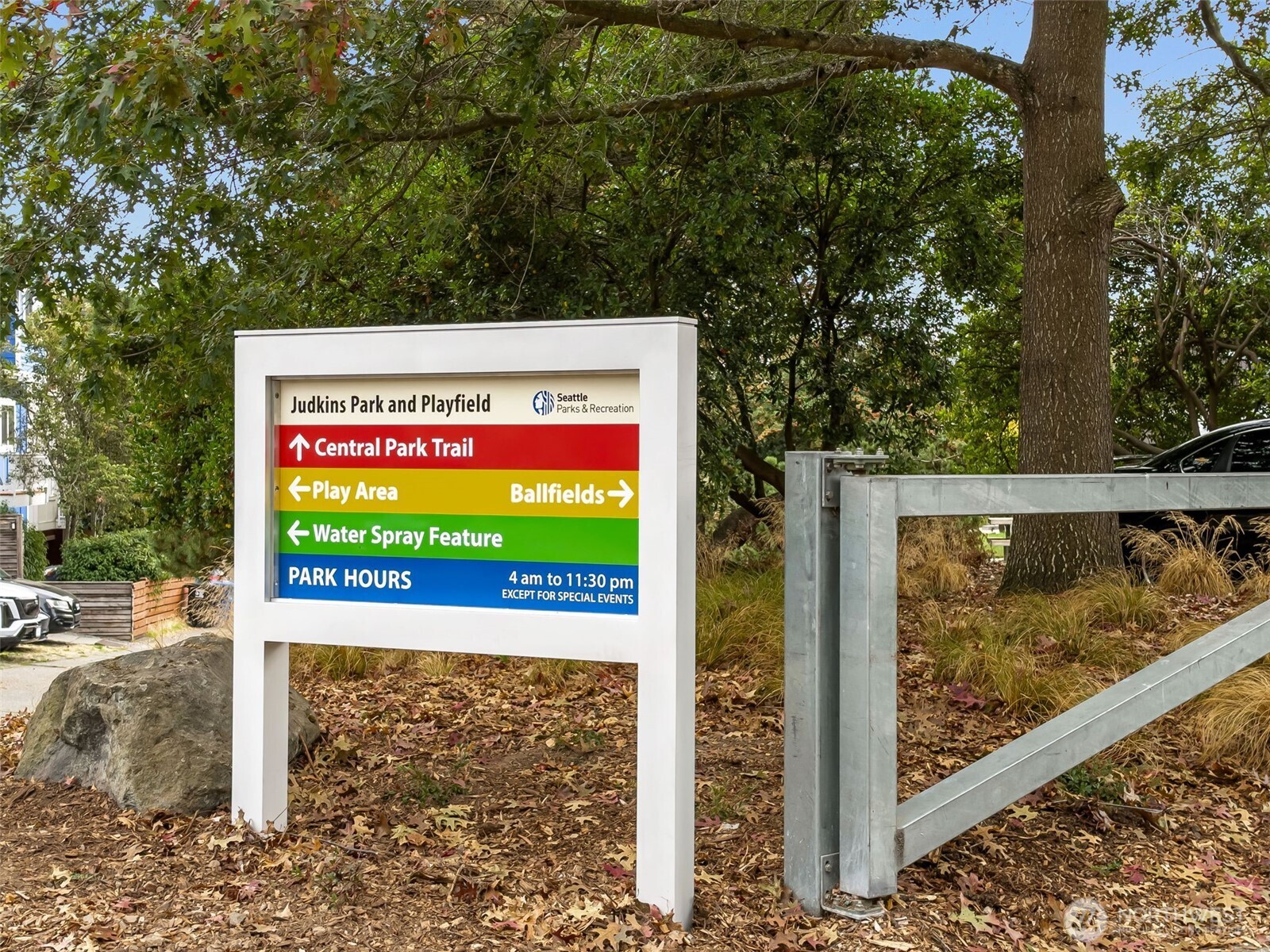 Judkins Park and Playfield sign points to the trail, play area, ballfields, and water spray feature.