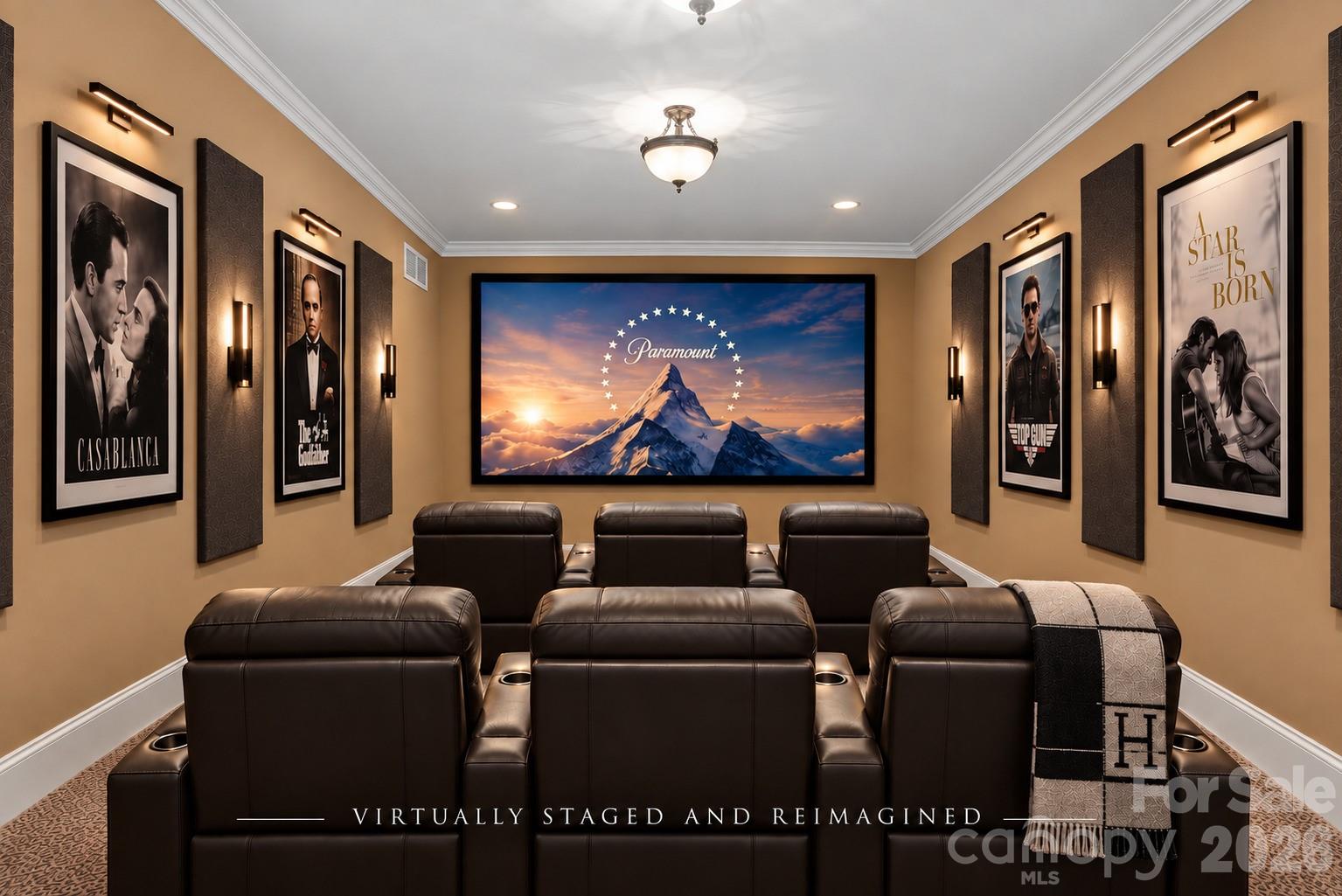 Home theater with leather recliners, framed movie posters, and a large Paramount screen.