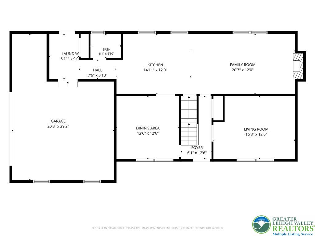 Floor plan showing the kitchen, family room, living room, dining area, garage, laundry, and bath.