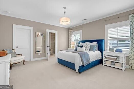 Bedroom with a blue upholstered bed, white bedding, and windows with blinds.