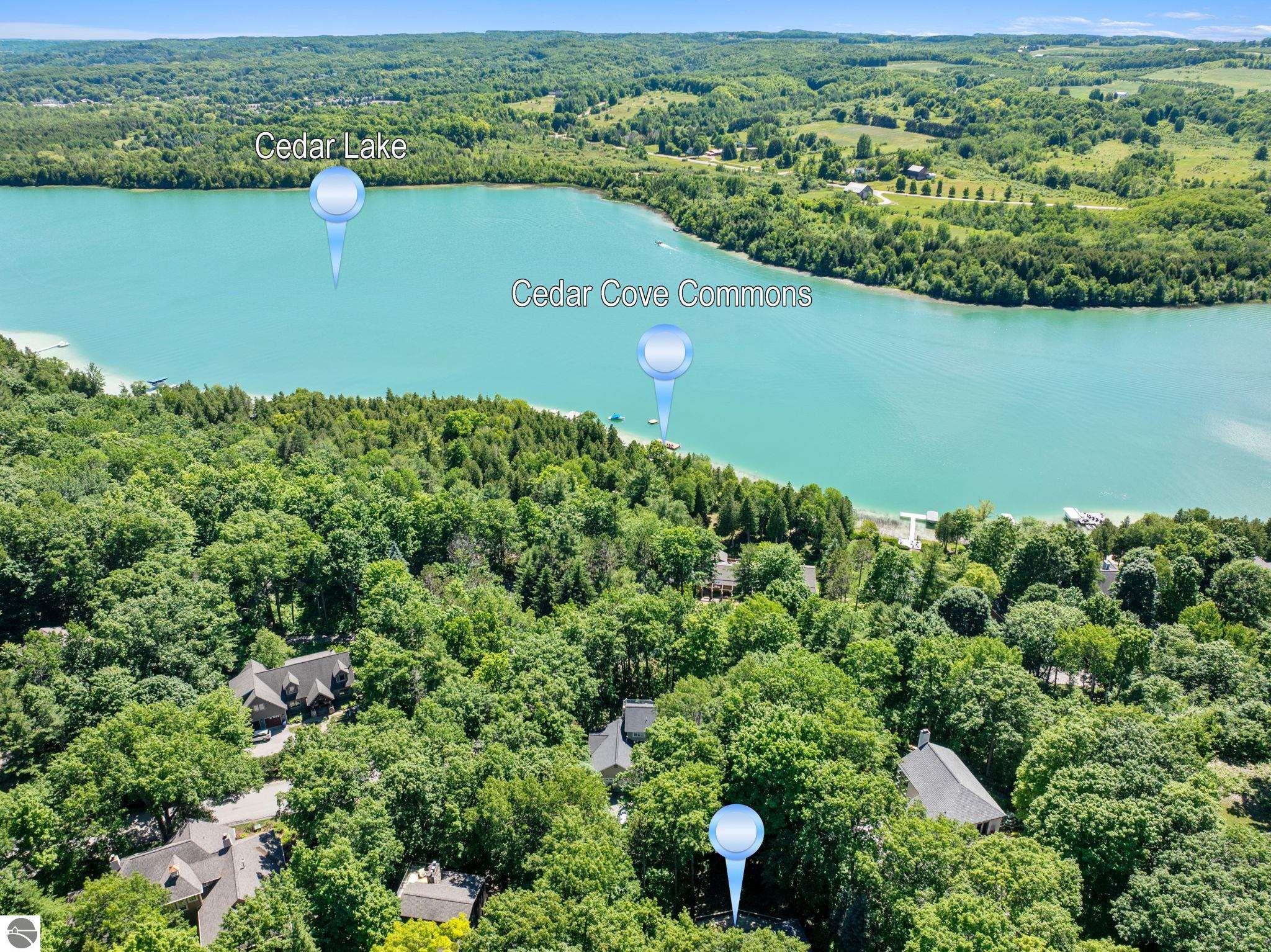Aerial view of Cedar Lake and Cedar Cove Commons, with wooded shoreline, homes, and location markers.