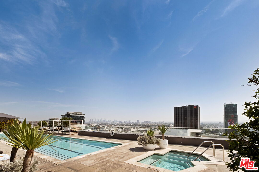Rooftop swimming pool and spa overlook the Los Angeles skyline.