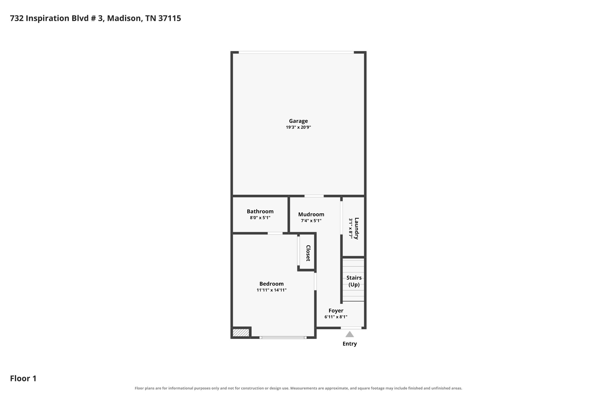 First-floor plan showing a garage, bedroom, bathroom, mudroom, laundry, foyer, and stairs.