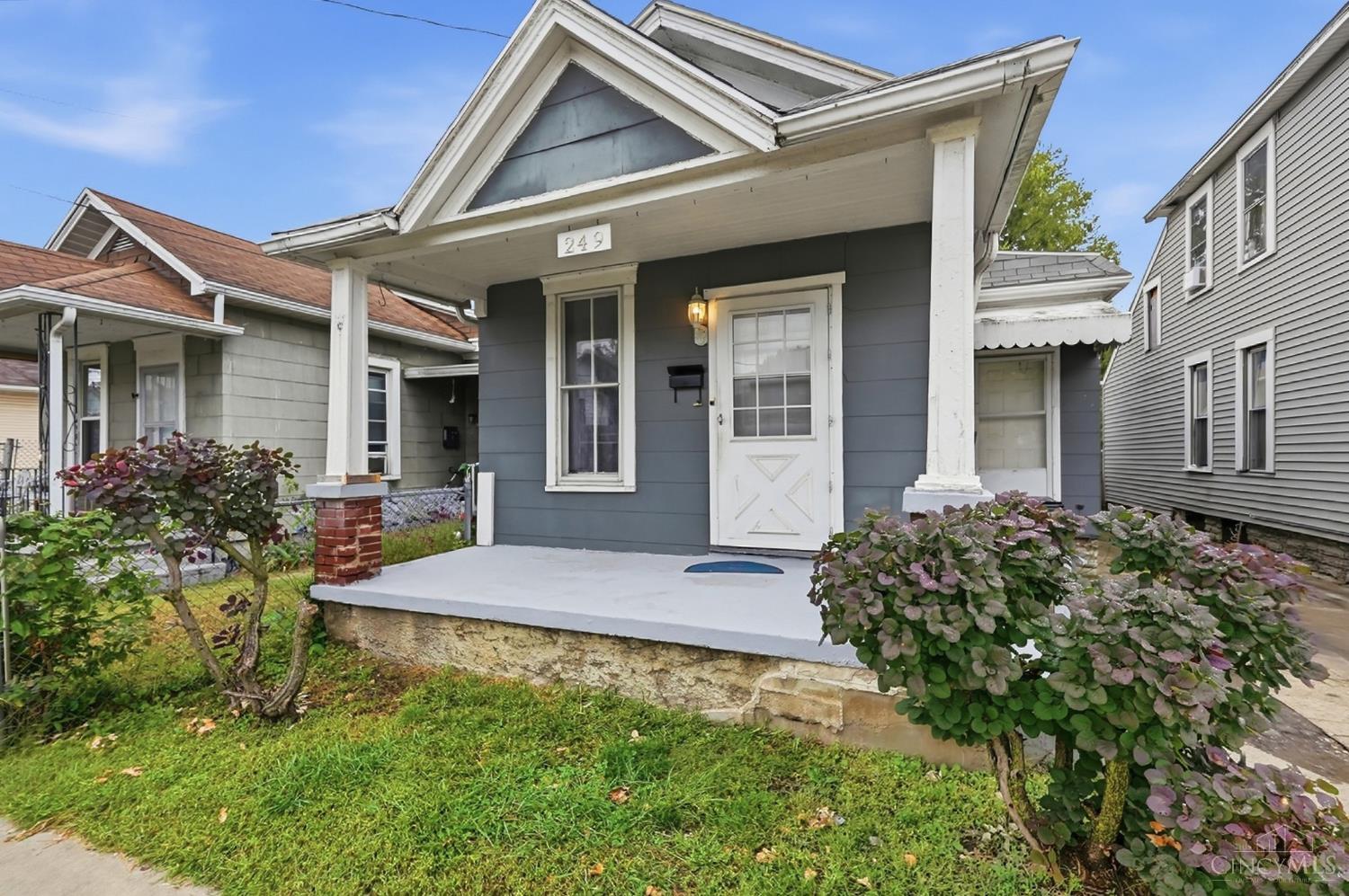 Blue-gray house at 249 Air Street with a covered front porch and white trim.