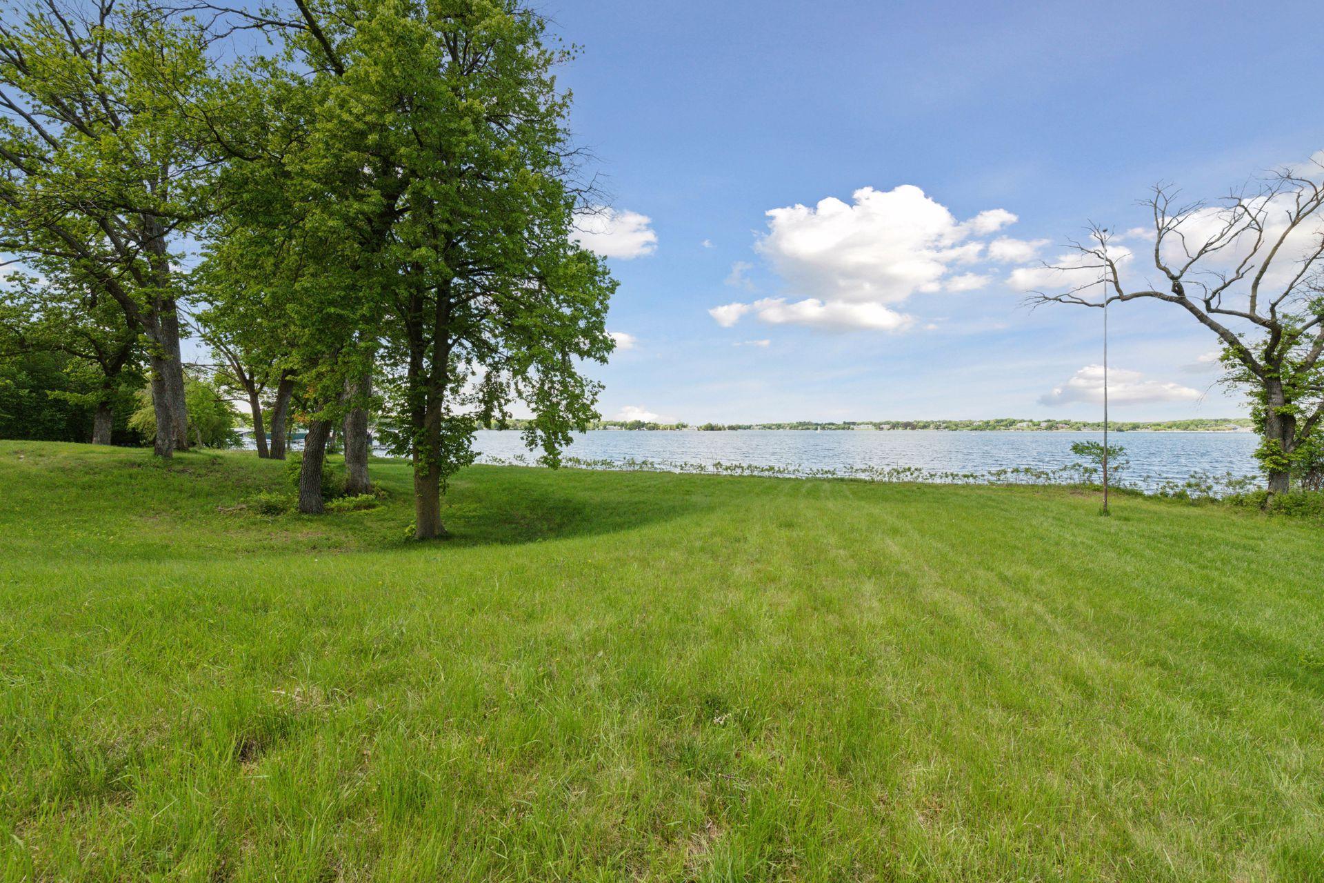Lake Minnetonka luxury estate site at 535 Bushaway Road Wayzata MN with west-facing shoreline