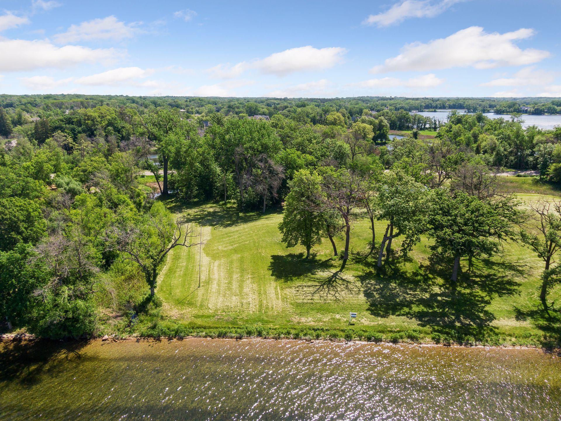 Lake Minnetonka luxury estate site at 535 Bushaway Road Wayzata MN with west-facing shoreline
