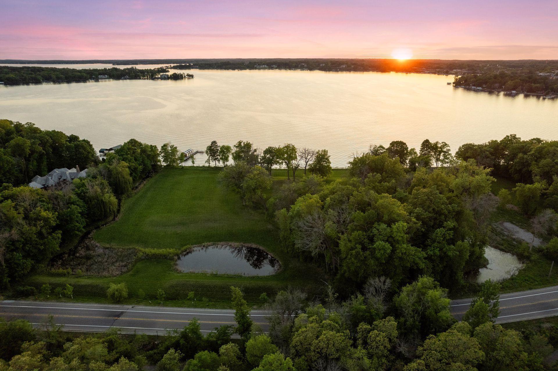 Lake Minnetonka luxury estate site at 535 Bushaway Road Wayzata MN with west-facing shoreline