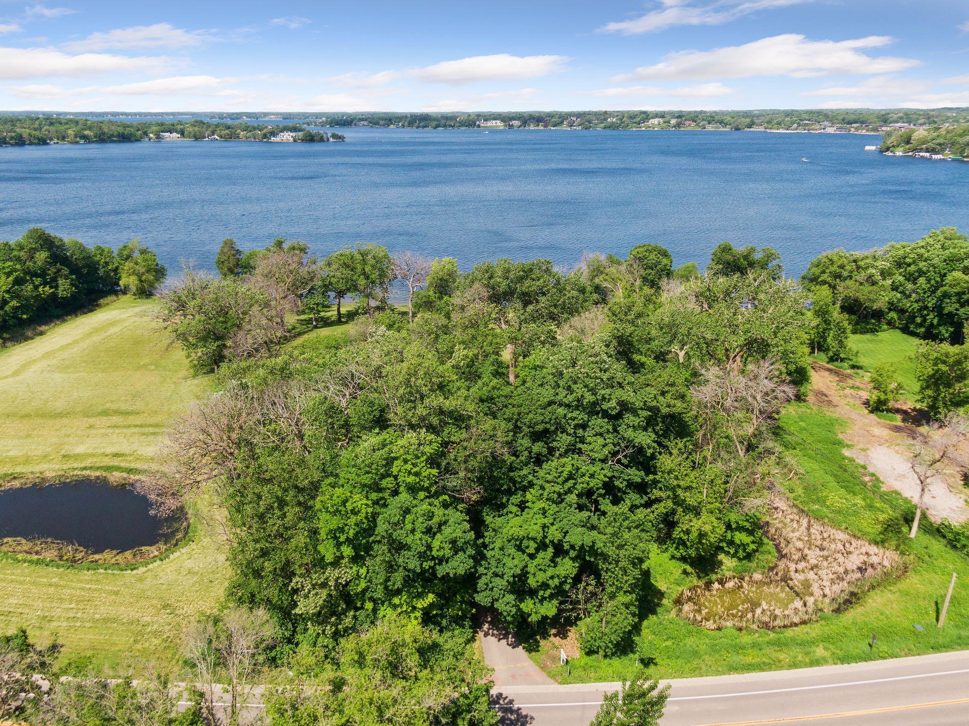 Lake Minnetonka luxury estate site at 555 Bushaway Road Wayzata MN with west-facing shoreline