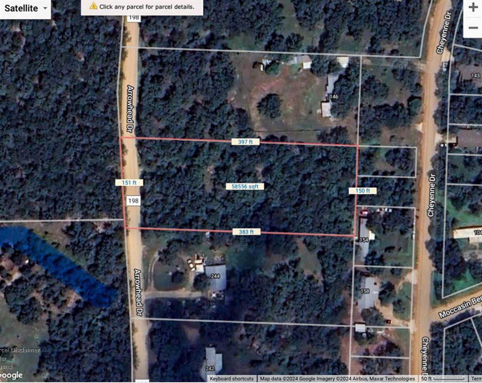 Aerial map of a wooded parcel outlined in red along Arrowhead Drive, with boundary dimensions and area marked.