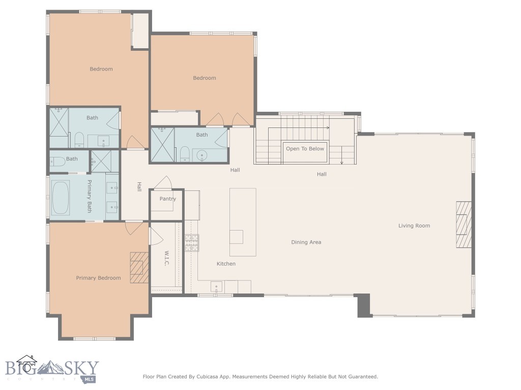 Floor plan showing three bedrooms, bathrooms, and an open kitchen, dining, and living area.