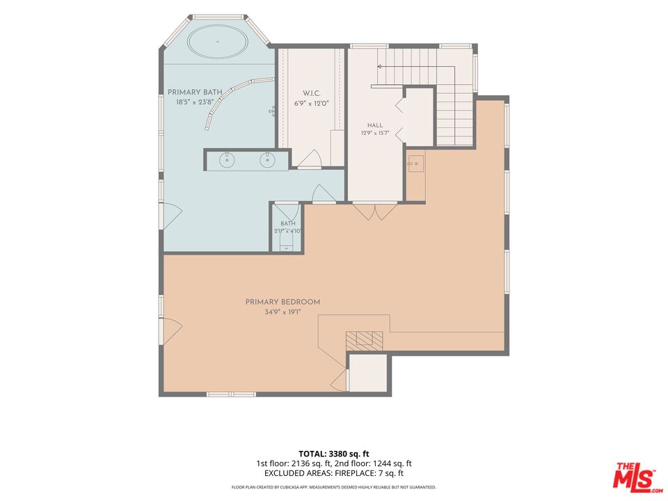 Floor plan showing a large primary bedroom, two baths, walk-in closet, hall, and staircase.
