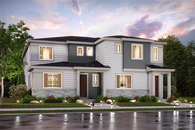 Two-story gray-and-white house with stone accents and a landscaped front yard at dusk.