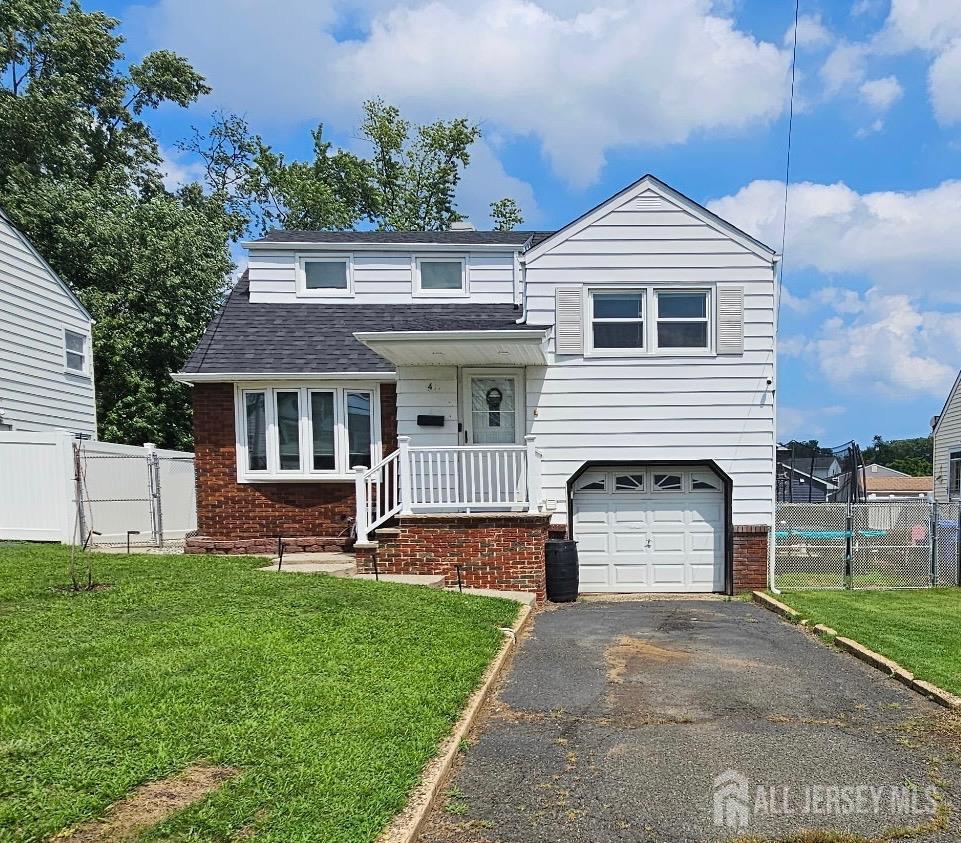 White-sided two-story home with red brick facade, front porch, attached garage, and driveway.