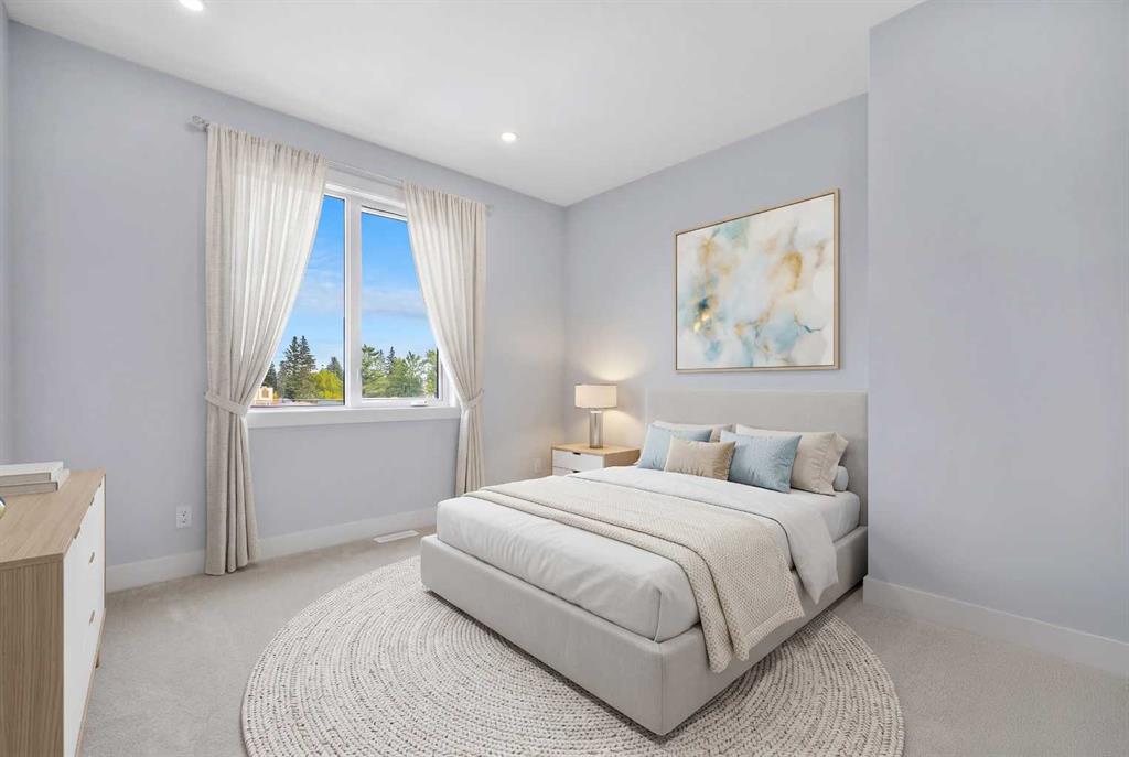 Staged bedroom with a light upholstered bed, abstract wall art, and a large curtained window.