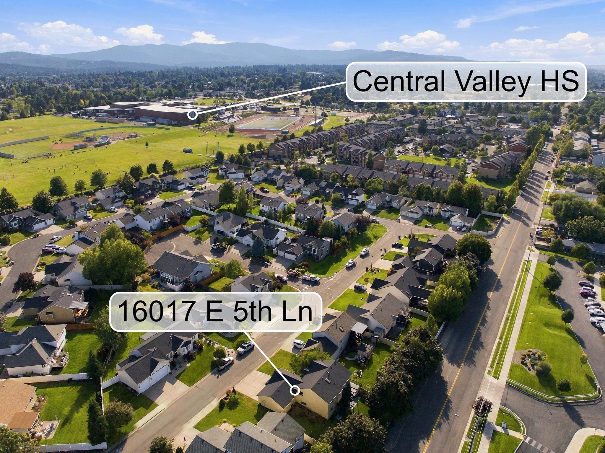Aerial view of 16017 E 5th Ln in a residential neighborhood near Central Valley HS.