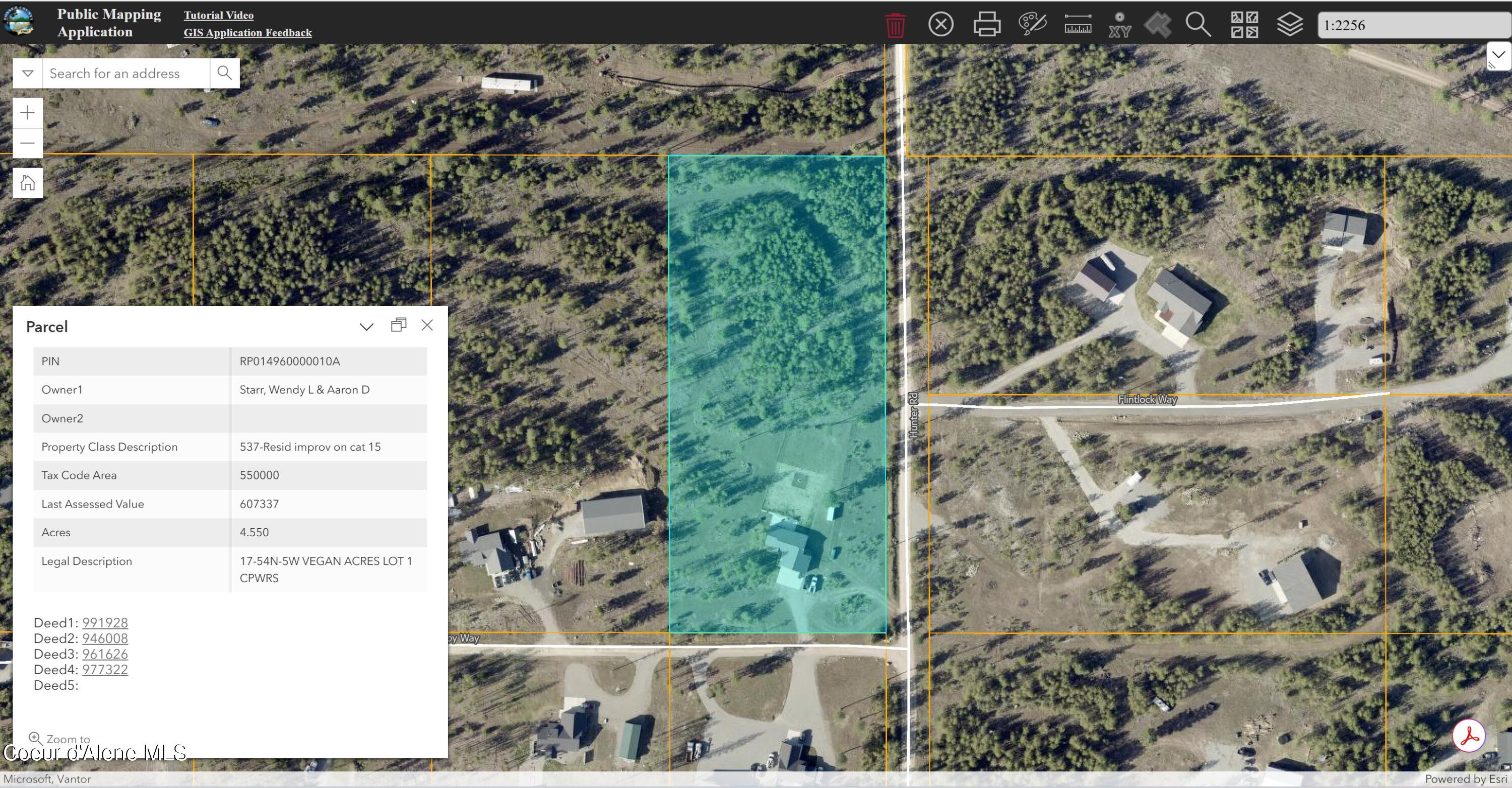 Aerial map of a wooded parcel highlighted in teal beside Hunter Road, with nearby homes and roads.