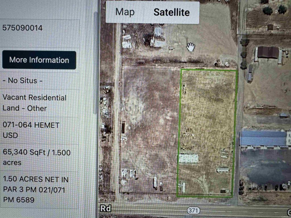 Aerial map of a vacant 1.5-acre parcel outlined in green beside Highway 371.