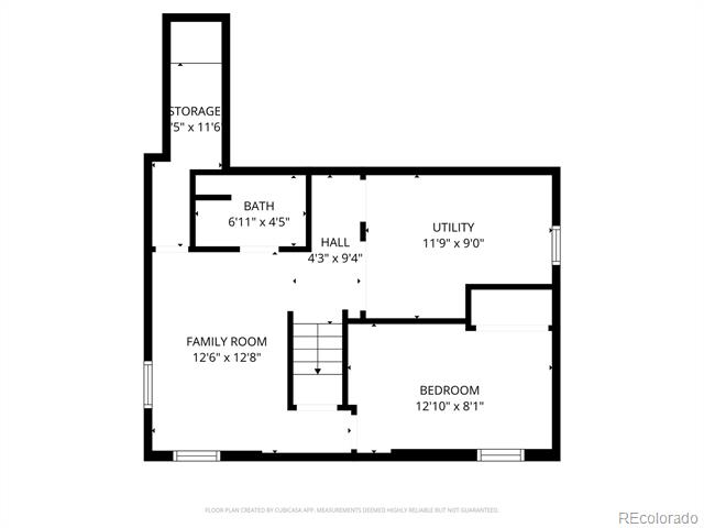 Floor plan showing a family room, bedroom, utility room, bathroom, storage room, and central staircase.