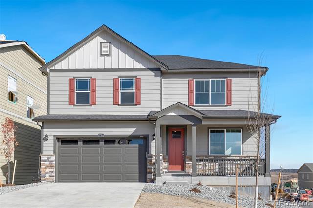 Two-story gray house with red shutters, a dark garage door, and a small covered front porch.