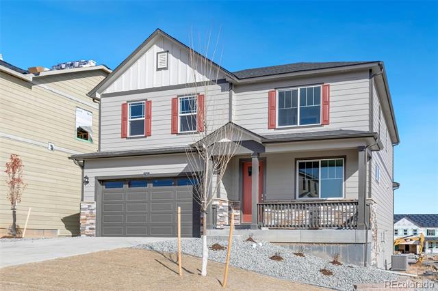 Two-story gray house with red shutters, a double garage, and a covered front porch.
