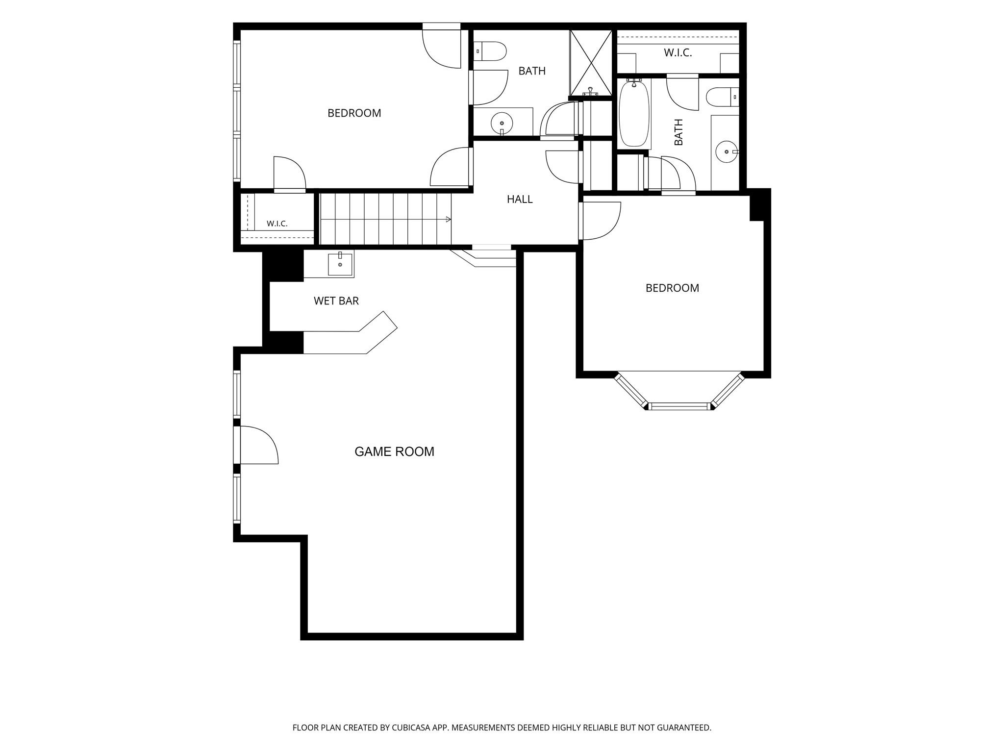 Floor plan with two bedrooms, two bathrooms, a wet bar, and a large game room.