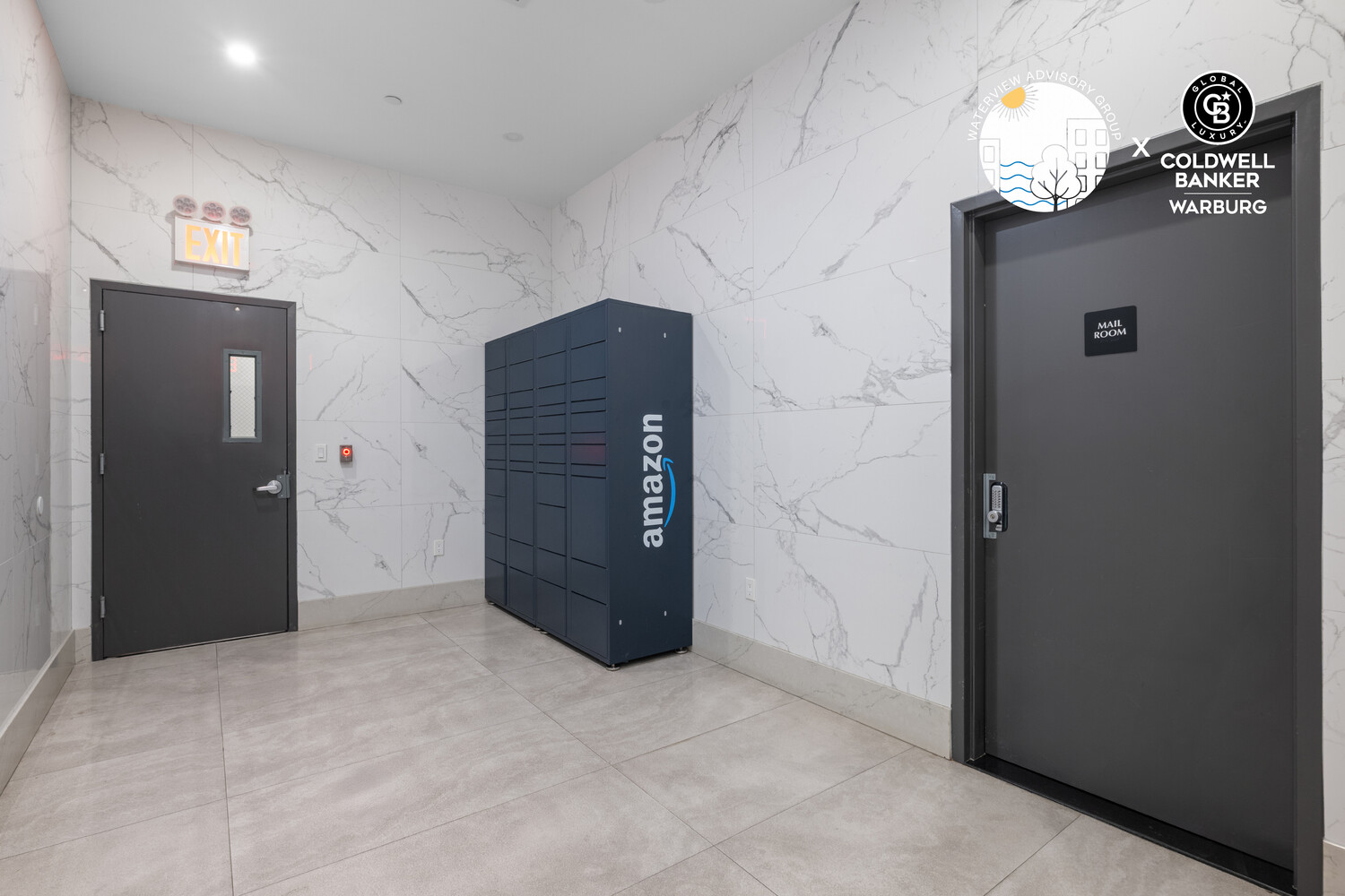 Building mailroom with blue Amazon package lockers, marble-look walls, and dark doors.