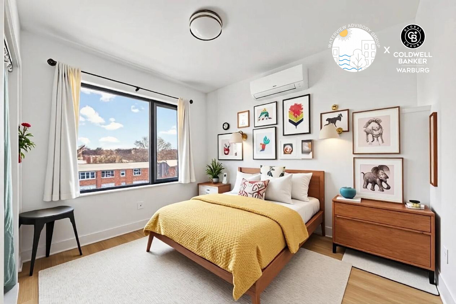 Bedroom with a mustard-yellow quilt, framed animal artwork, and a large window with white curtains.