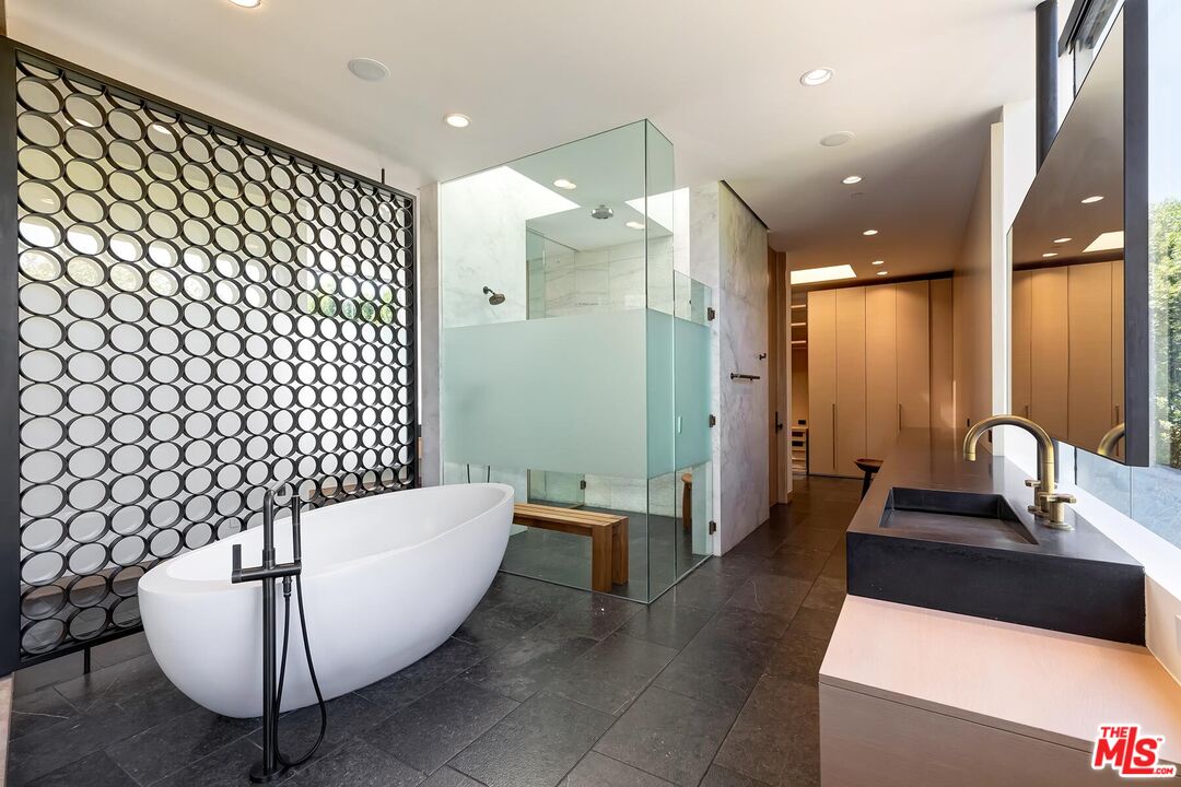 Located in the guard-gated Stoneridge Estates