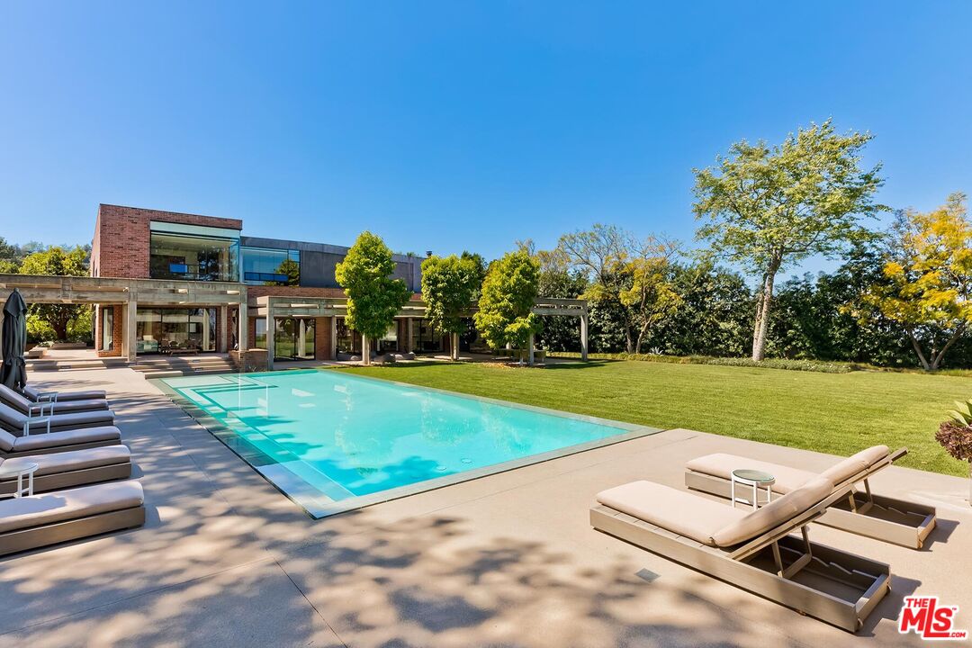 Located in the guard-gated Stoneridge Estates