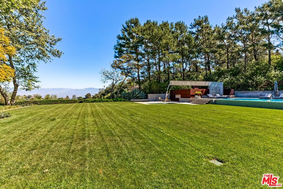 Located in the guard-gated Stoneridge Estates