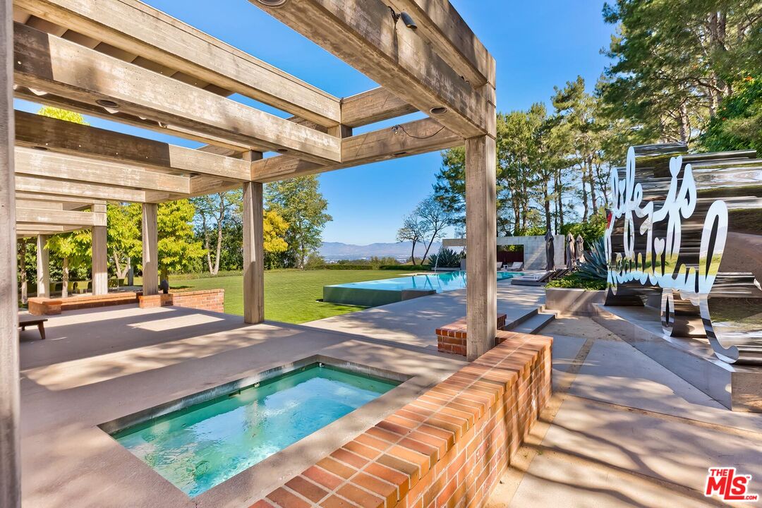 Located in the guard-gated Stoneridge Estates