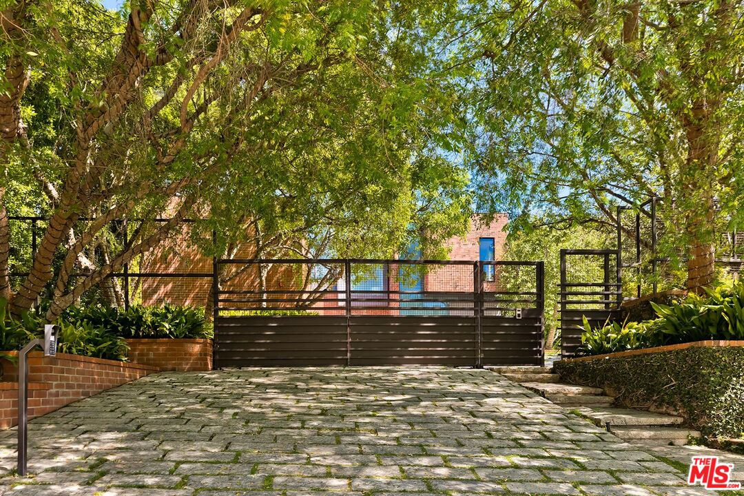 Located in the guard-gated Stoneridge Estates