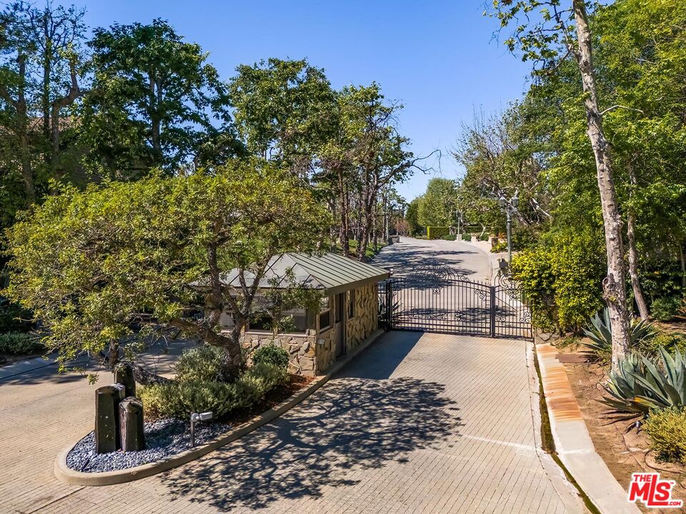 Located in the guard-gated Stoneridge Estates