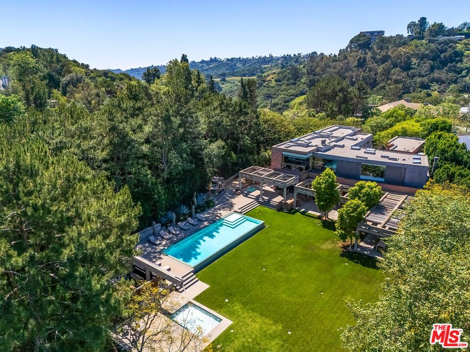 Located in the guard-gated Stoneridge Estates