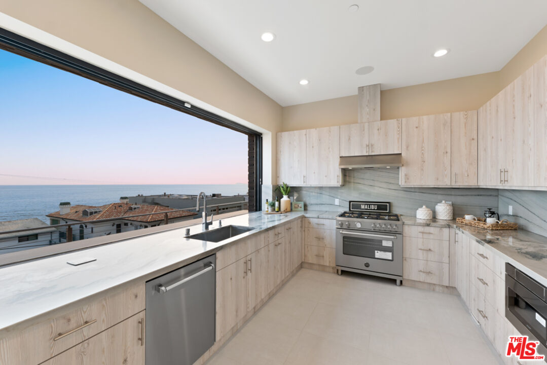 Expansive Ocean and City Light Views