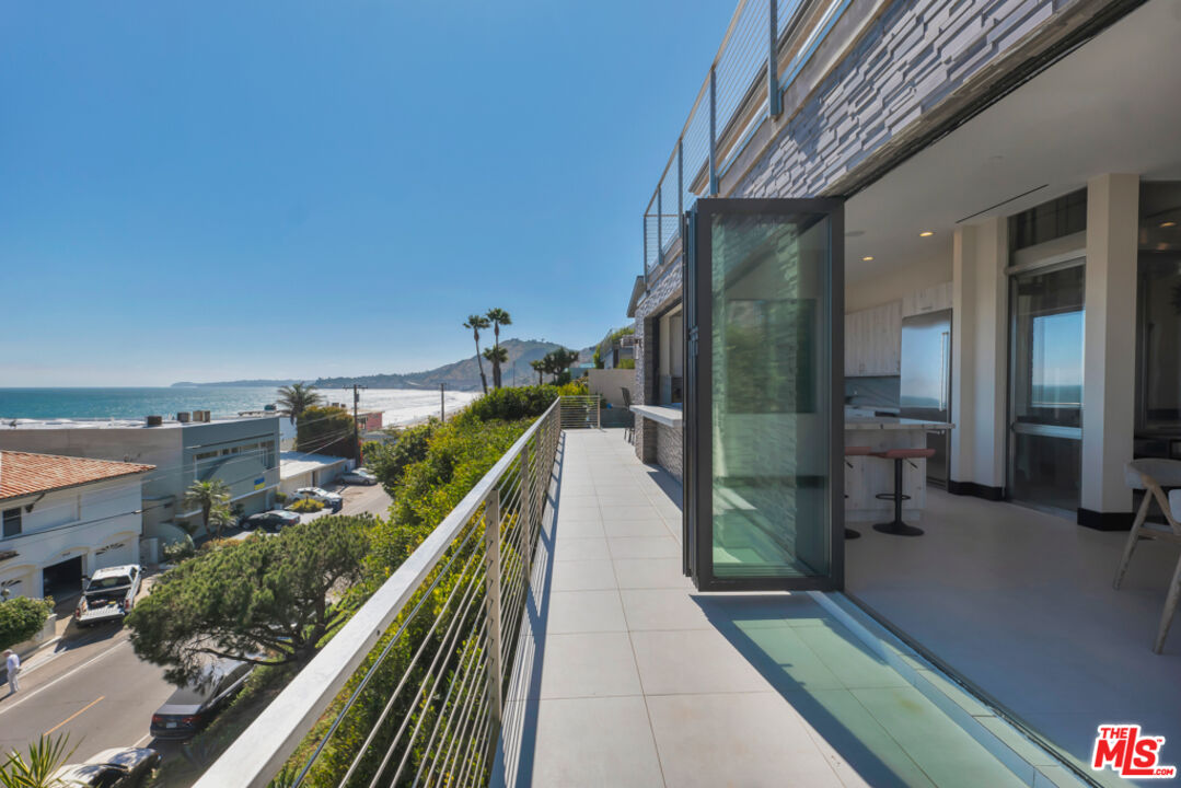 Expansive Ocean and City Light Views