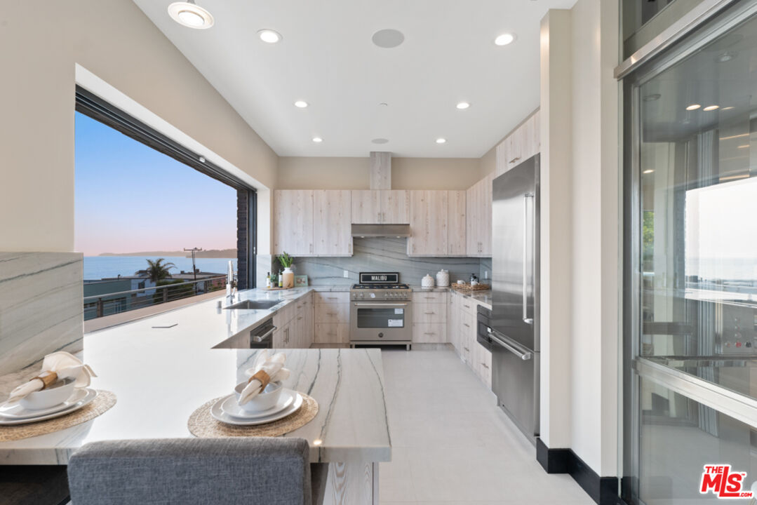 Expansive Ocean and City Light Views