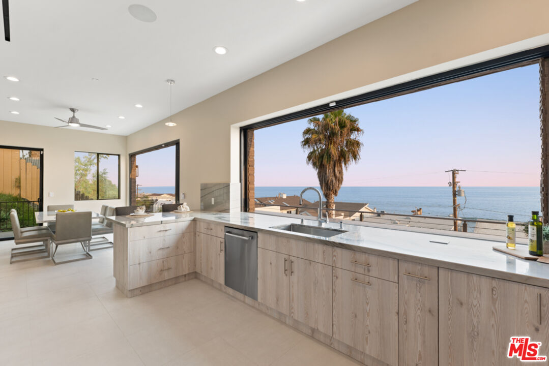 Expansive Ocean and City Light Views
