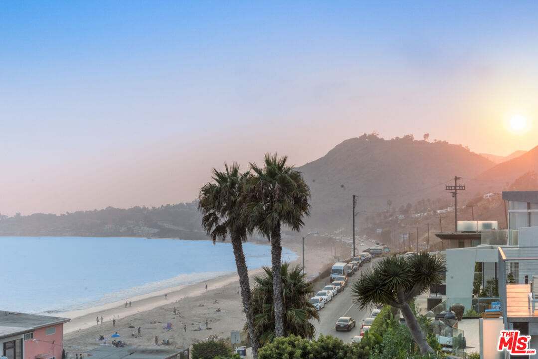 Expansive Ocean and City Light Views