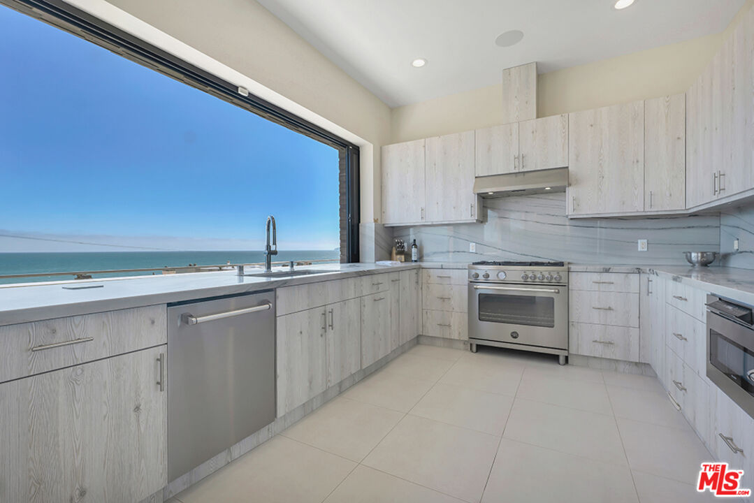 Expansive Ocean and City Light Views