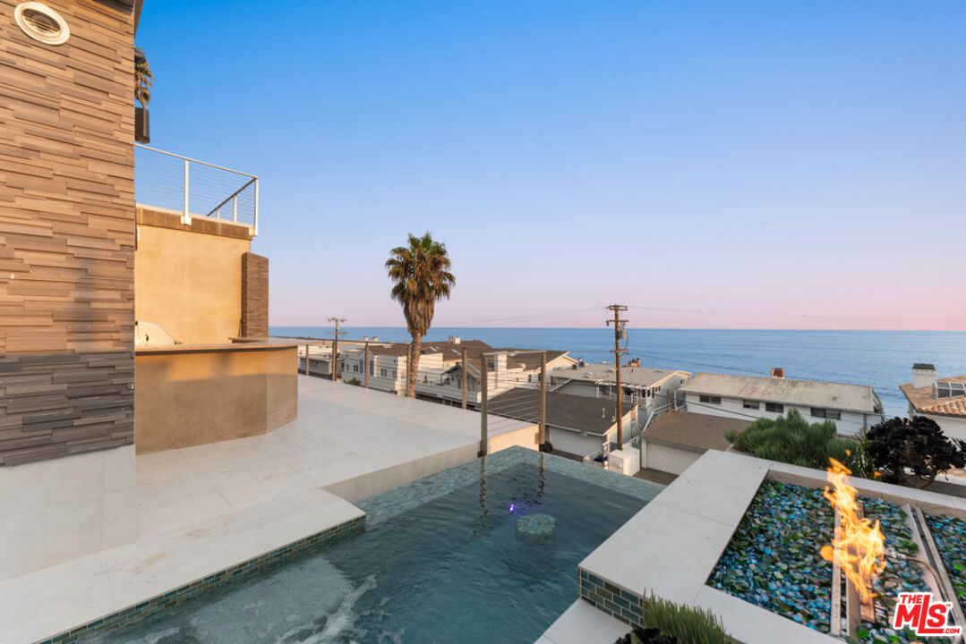Expansive Ocean and City Light Views