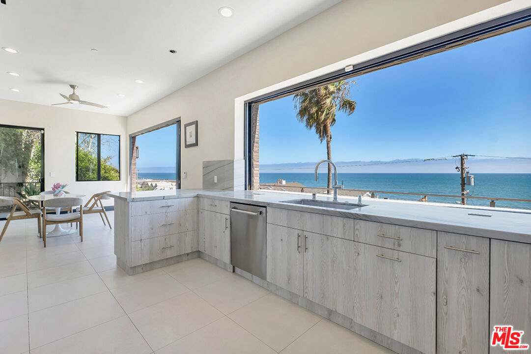 Expansive Ocean and City Light Views